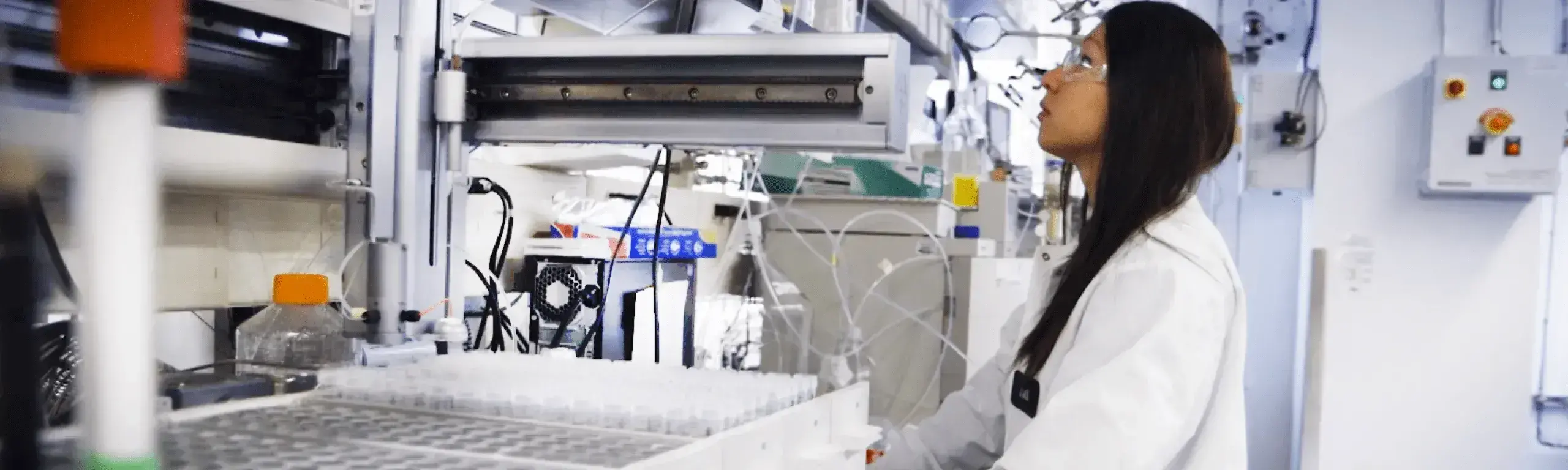 Scientist in laboratory working at a bench